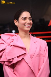 Actress Tamannaah Bhatia in a pink pant suit dress