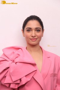 Actress Tamannaah Bhatia in a pink pant suit dress