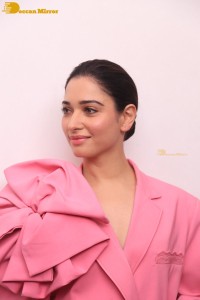 Actress Tamannaah Bhatia in a pink pant suit dress