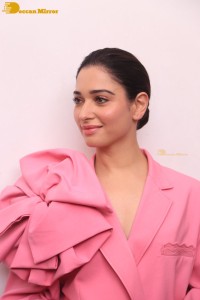 Actress Tamannaah Bhatia in a pink pant suit dress