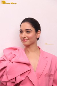 Actress Tamannaah Bhatia in a pink pant suit dress