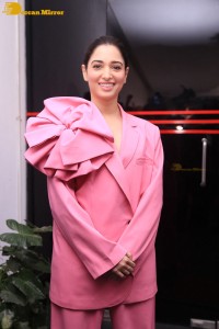 Actress Tamannaah Bhatia in a pink pant suit dress