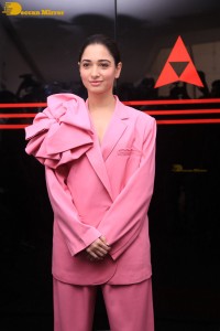 Actress Tamannaah Bhatia in a pink pant suit dress