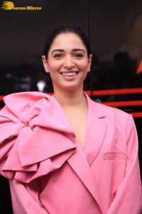 Actress Tamannaah Bhatia in a pink pant suit dress
