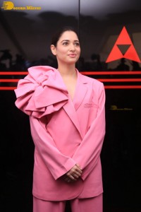 Actress Tamannaah Bhatia in a pink pant suit dress