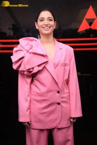 Actress Tamannaah Bhatia in a pink pant suit dress