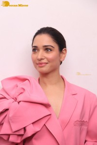 Actress Tamannaah Bhatia in a pink pant suit dress