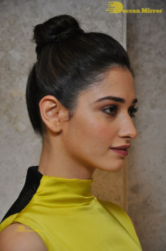 Bollywood and Telugu Actress Tamannaah Bhatia in a yellow dress