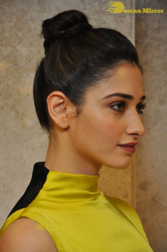Bollywood and Telugu Actress Tamannaah Bhatia in a yellow dress