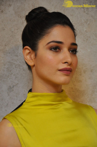 Bollywood and Telugu Actress Tamannaah Bhatia in a yellow dress