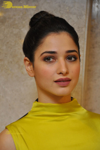 Bollywood and Telugu Actress Tamannaah Bhatia in a yellow dress
