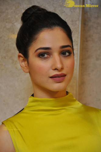 Bollywood and Telugu Actress Tamannaah Bhatia in a yellow dress
