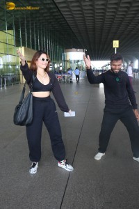 actress Tamannaah Bhatia dances with a Cameraman at Mumbai Airport