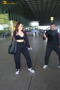 actress Tamannaah Bhatia dances with a Cameraman at Mumbai Airport