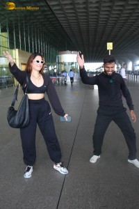 actress Tamannaah Bhatia dances with a Cameraman at Mumbai Airport