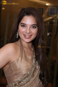 actress Tanya Hope dazzles in a gold color saree