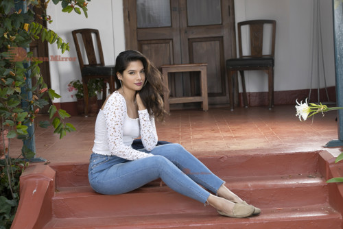 Model and Telugu Actress Tanya Hope in a white top and blue jeans