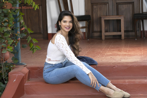 Model and Telugu Actress Tanya Hope in a white top and blue jeans