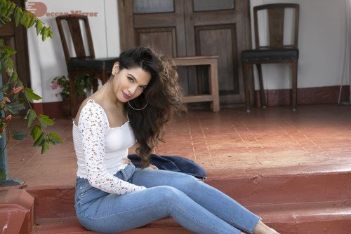 Model and Telugu Actress Tanya Hope in a white top and blue jeans