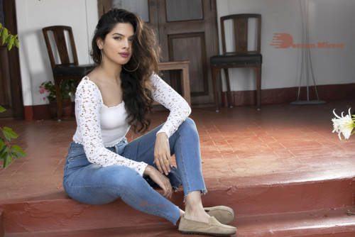 Model and Telugu Actress Tanya Hope in a white top and blue jeans