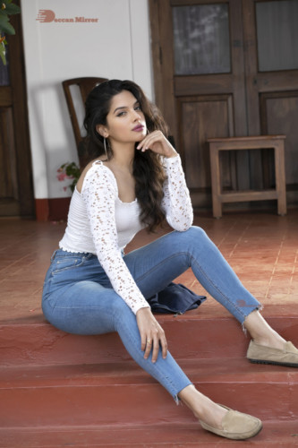 Model and Telugu Actress Tanya Hope in a white top and blue jeans
