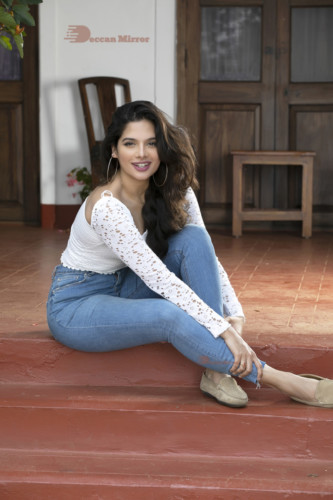 Model and Telugu Actress Tanya Hope in a white top and blue jeans