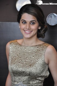 Tapsee Pannu in a dark gold colored dress