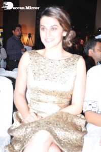 Tapsee Pannu in a dark gold colored dress