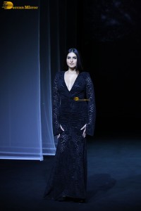 Bollywood actress Tara Sutaria in a black dress doing a ramp walk