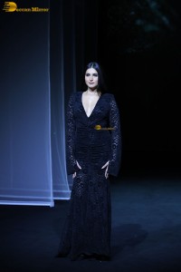 Bollywood actress Tara Sutaria in a black dress doing a ramp walk