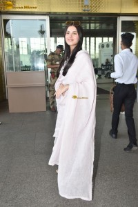 actress Tara Sutaria n a short white dress