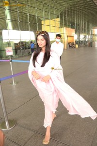 actress Tara Sutaria n a short white dress