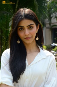 Tollywood actress tina shilparaj in a white top and colorful skirt