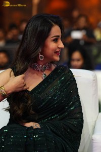 Indian actress trisha shines in a green saree at a movie event