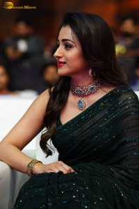Indian actress trisha shines in a green saree at a movie event