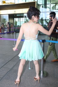 urfi javed in a green top and mini skirt at mumbai airport