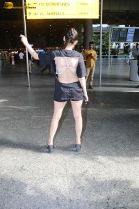 actress urfi javed in a open back black dress at airport