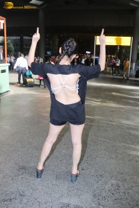 actress urfi javed in a open back black dress at airport