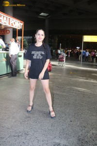 actress urfi javed in a open back black dress at airport