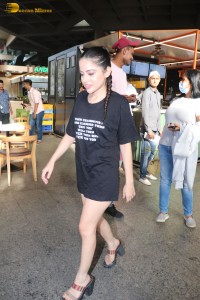 actress urfi javed in a open back black dress at airport