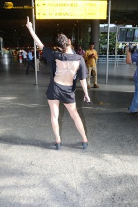 actress urfi javed in a open back black dress at airport