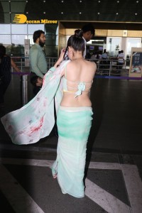 Urfi Javed in a green saree at the Mumbai Airport