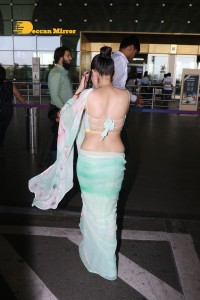 Urfi Javed in a green saree at the Mumbai Airport