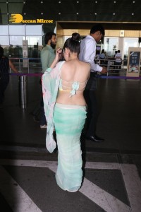 Urfi Javed in a green saree at the Mumbai Airport