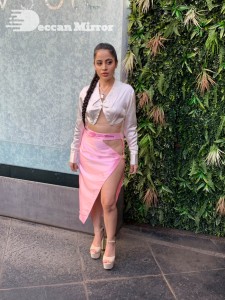 Urfi Javed in a pink shirt and a slit pink skirt