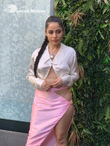 Urfi Javed in a pink shirt and a slit pink skirt