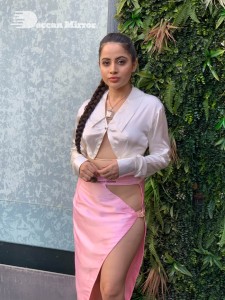 Urfi Javed in a pink shirt and a slit pink skirt