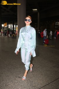 Urvashi Rautela in a blue dress at the Airport