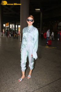 Urvashi Rautela in a blue dress at the Airport