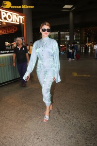 Urvashi Rautela in a blue dress at the Airport